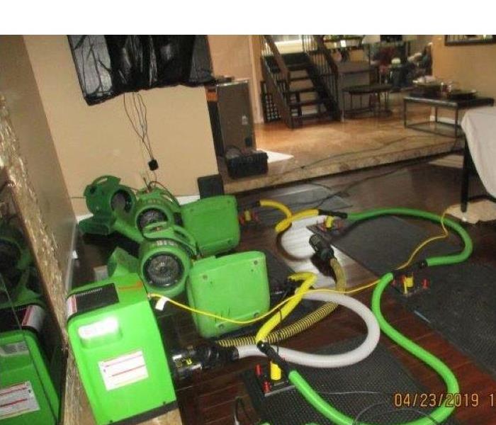 Water damage to hardwood flooring in Portage County home